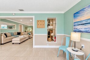 This thoughtfully designed space serves as a welcoming alcove, providing a charming spot for guests to gather and unwind.