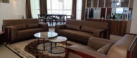 Executive Apartment | Living area | 55-inch Smart TV with satellite channels, Netflix, streaming services