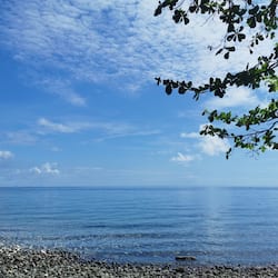 On the beach, black sand
