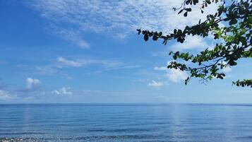 On the beach, black sand