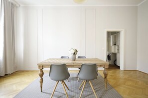 Deluxe Apartment | Living area | 40-inch LCD TV with cable channels - HeyMi Apartments Karlsplatz (Vienna)