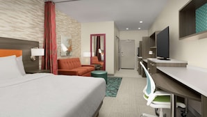 A hotel room with a bed, a desk, a chair, a TV, and a bathroom.