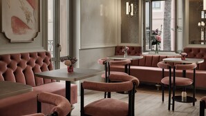 A modern interior with plush seating, a dining area, and artwork on the walls. - Domus Blanc Boutique Hotel, Member of Domus Elegance Collection (Chania)