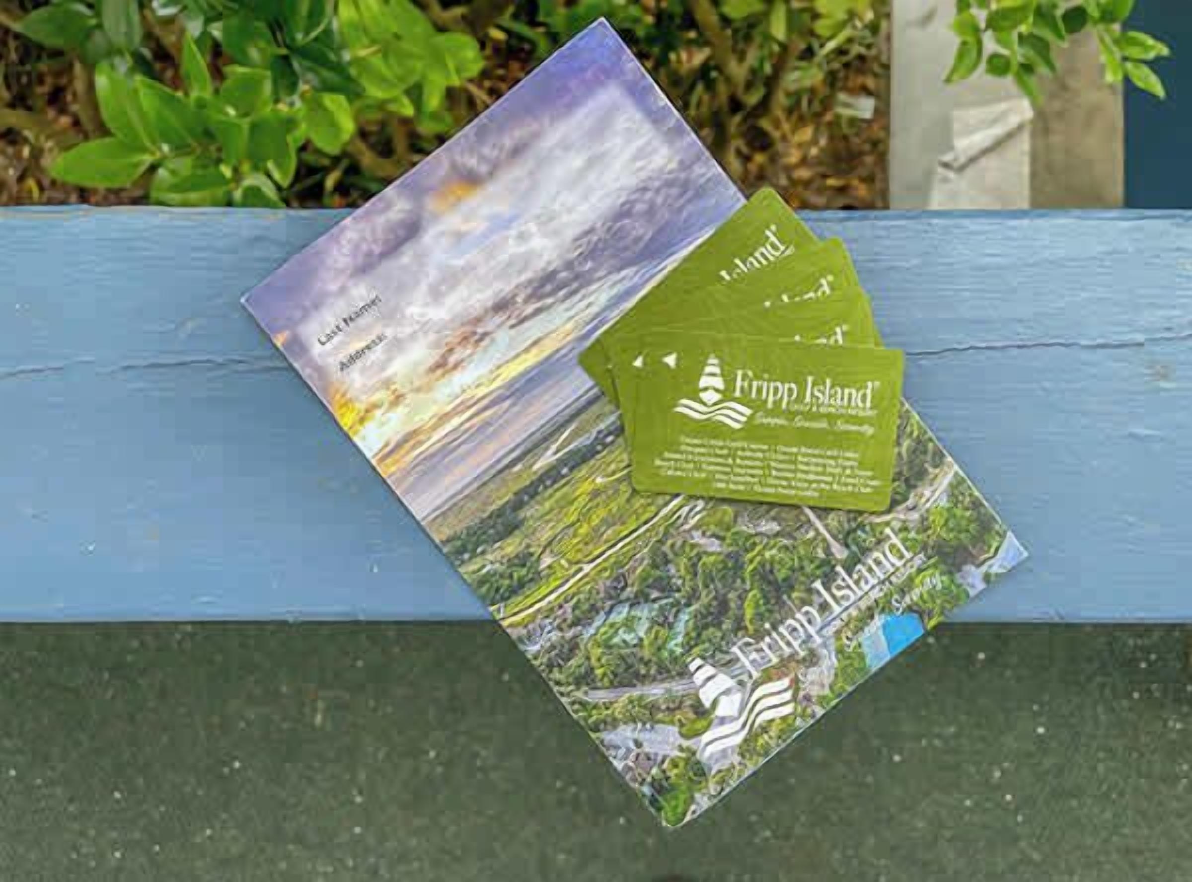Two brochures for Fripp Island, one with a scenic landscape and the other with a map.