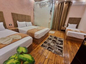 Quadruple Room | Egyptian cotton sheets, premium bedding, pillowtop beds, in-room safe - Cairo plaza 2 hotel (Cairo)