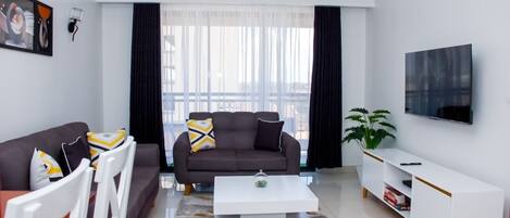 Appartamento Business | Area soggiorno | Smart TV 24 pollici con canali satellitari