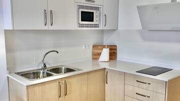 Fridge, electric kettle, toaster, cookware/dishes/utensils