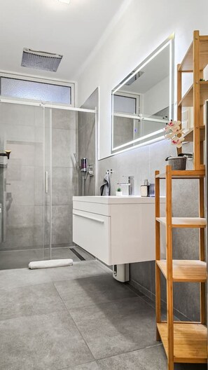 Shower, eco-friendly toiletries, hair dryer, towels