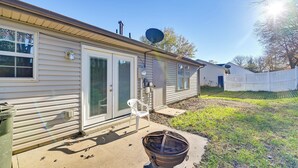 A single-story mobile home with a satellite dish, a small outdoor chair, and a trash can. - Georgetown Home ~ 6 Mi to Kentucky Horse Park! (Georgetown)