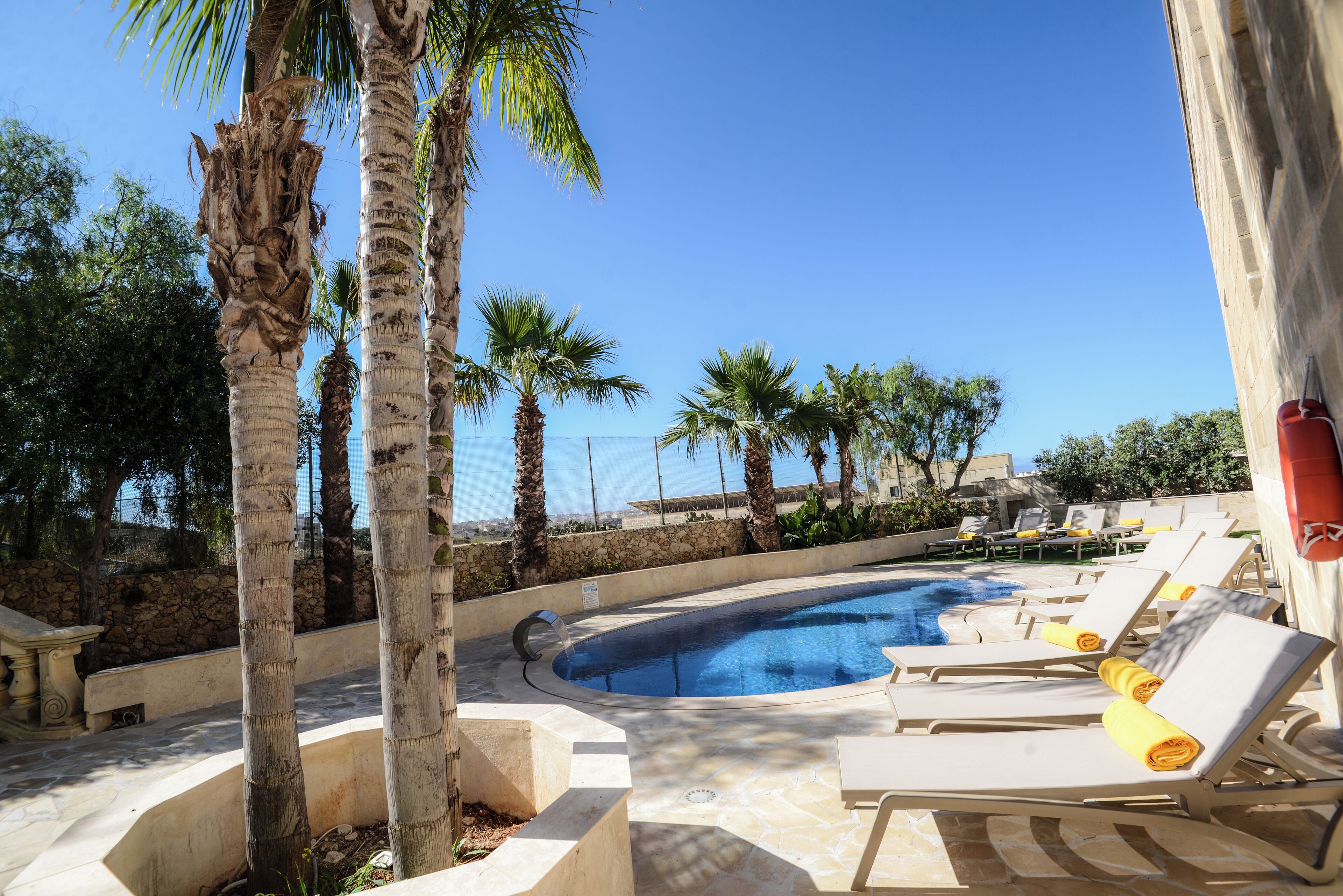 Outdoor pool, open 9:00 AM to 6:30 PM, pool umbrellas, pool loungers