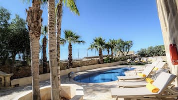 Outdoor pool, open 9:00 AM to 6:30 PM, pool umbrellas, pool loungers