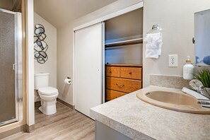 Shower, hair dryer, towels, soap