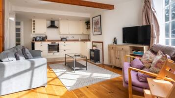 Basic House, Multiple Beds | Living area | TV