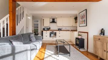 Basic House, Multiple Beds | Living area | TV