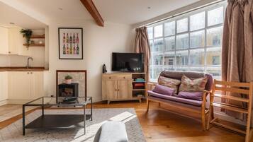 Basic House, Multiple Beds | Living area | TV