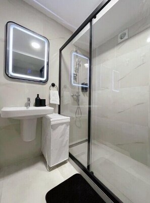 Shower, hair dryer, towels, soap