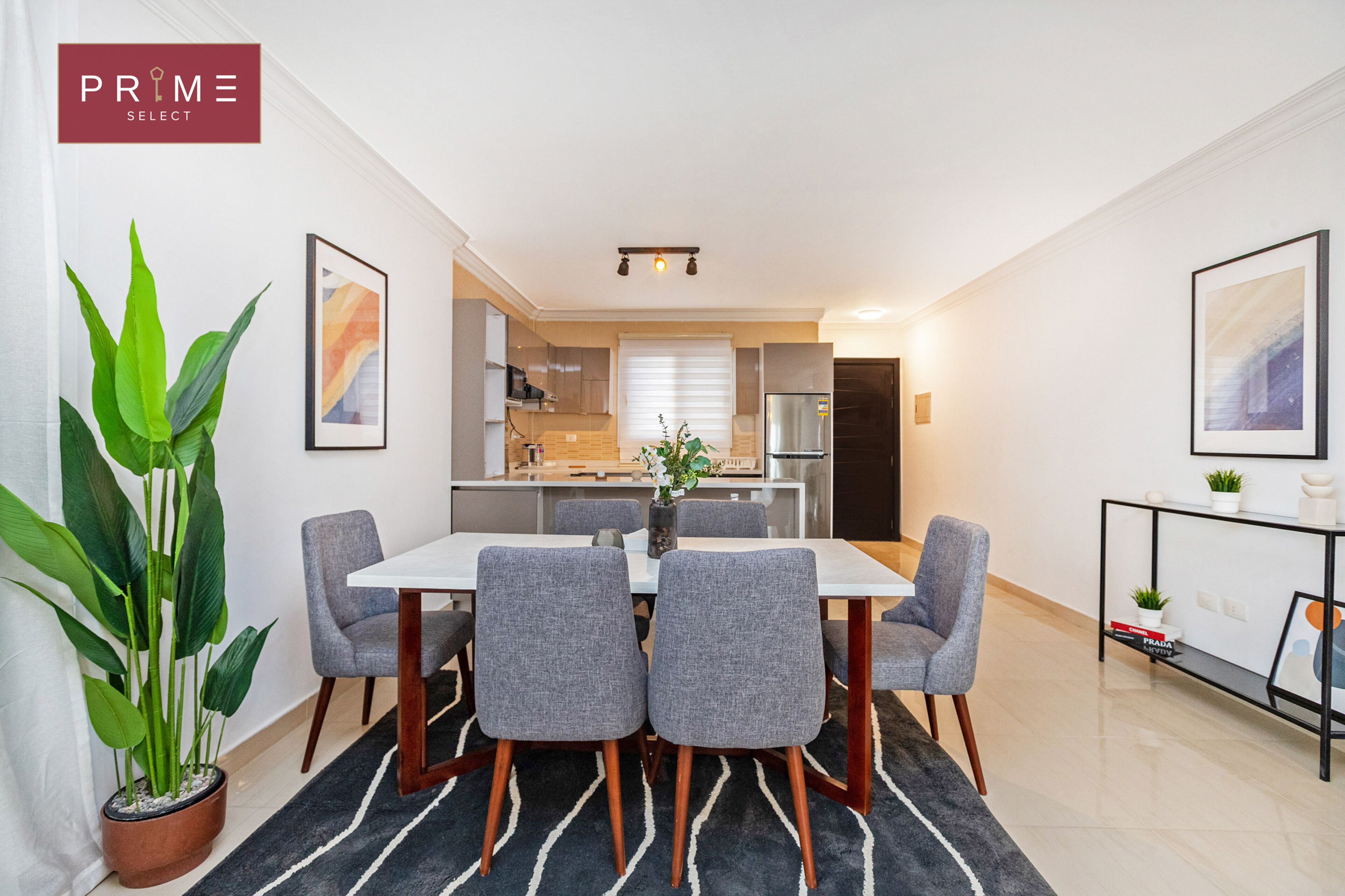 A modern kitchen with a dining area.