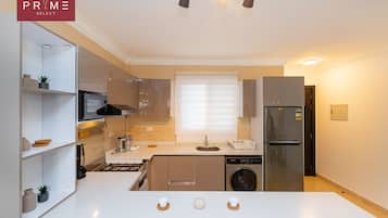 Superior Apartment, 2 Bedrooms | Private kitchen | Full-size fridge, microwave, cookware/dishes/utensils