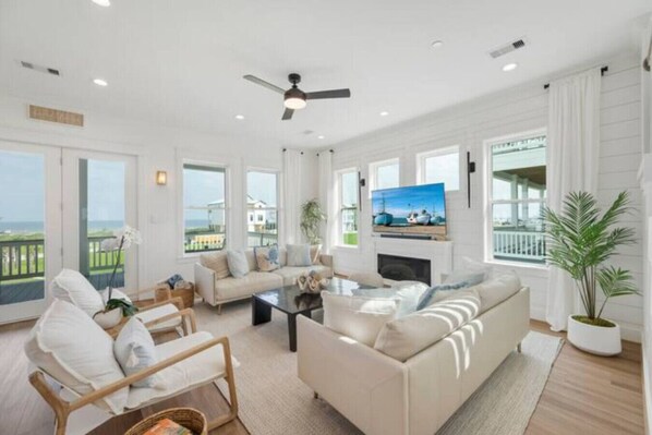 Smart TV, fireplace, books, offices