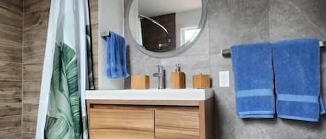 Shower, hair dryer, towels, soap