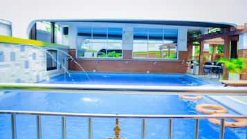 Outdoor pool, open 6:30 AM to 6:30 PM, pool loungers