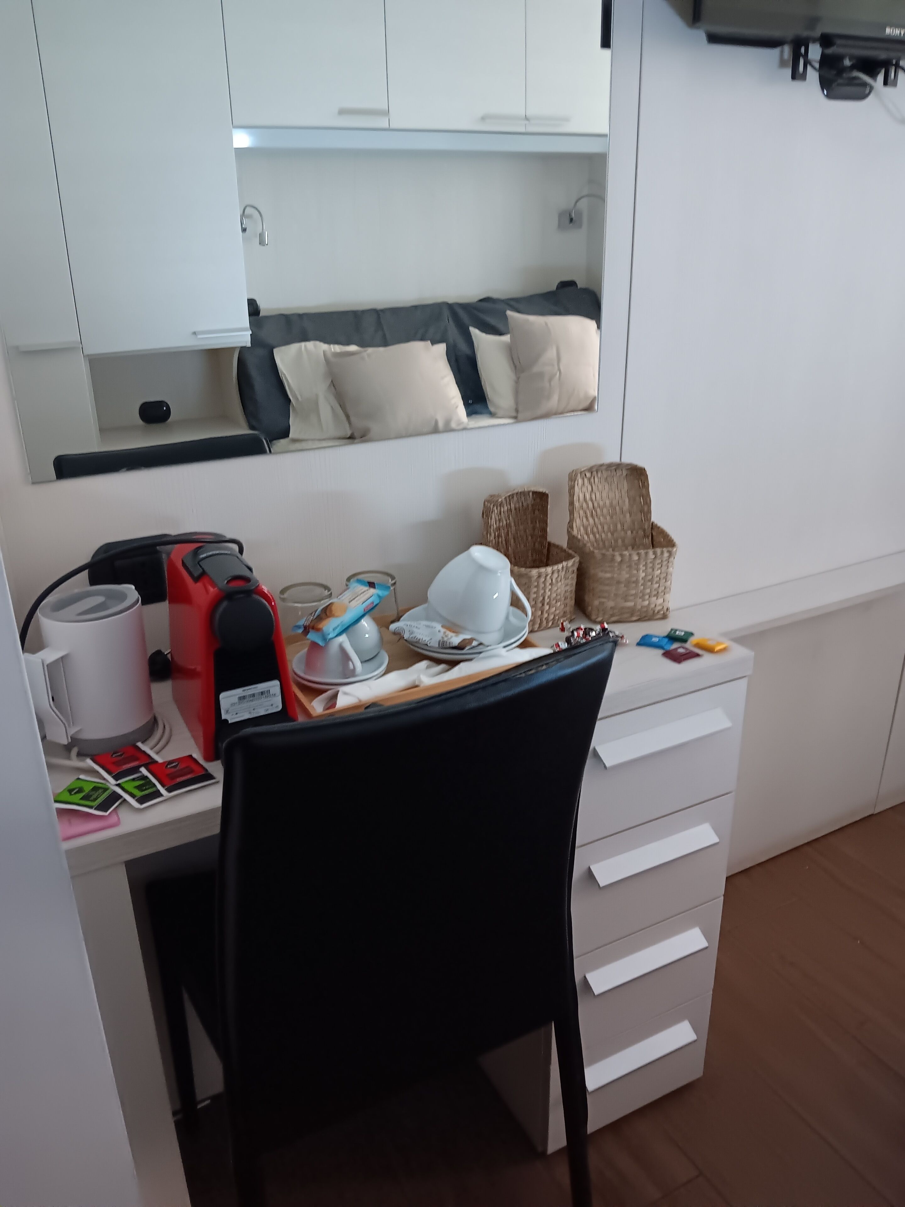 A neatly organized workspace with a desk, chair, and various office supplies.