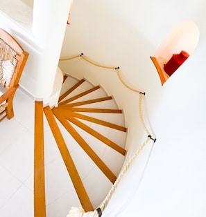 A spiral staircase with wooden steps and a rope barrier. - 54 Golfmar Carvoeiro apartment with fabulous pool (Carvoeiro)