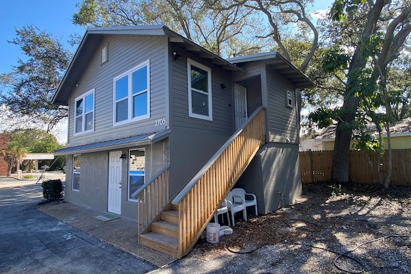 Stairway to upper unit of duplex and side yard is now fenced