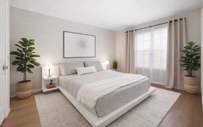 A modern bedroom with a large bed, bedside tables, and potted plants.