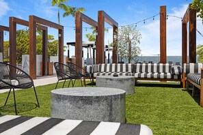 Rooftop lounge with sofas and string lights