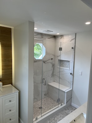 Shower, hair dryer, towels, soap