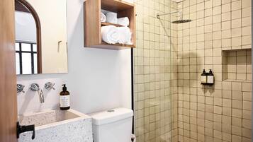 Shower, rainfall showerhead, hair dryer, towels