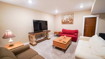 Smart TV, fireplace, foosball, books