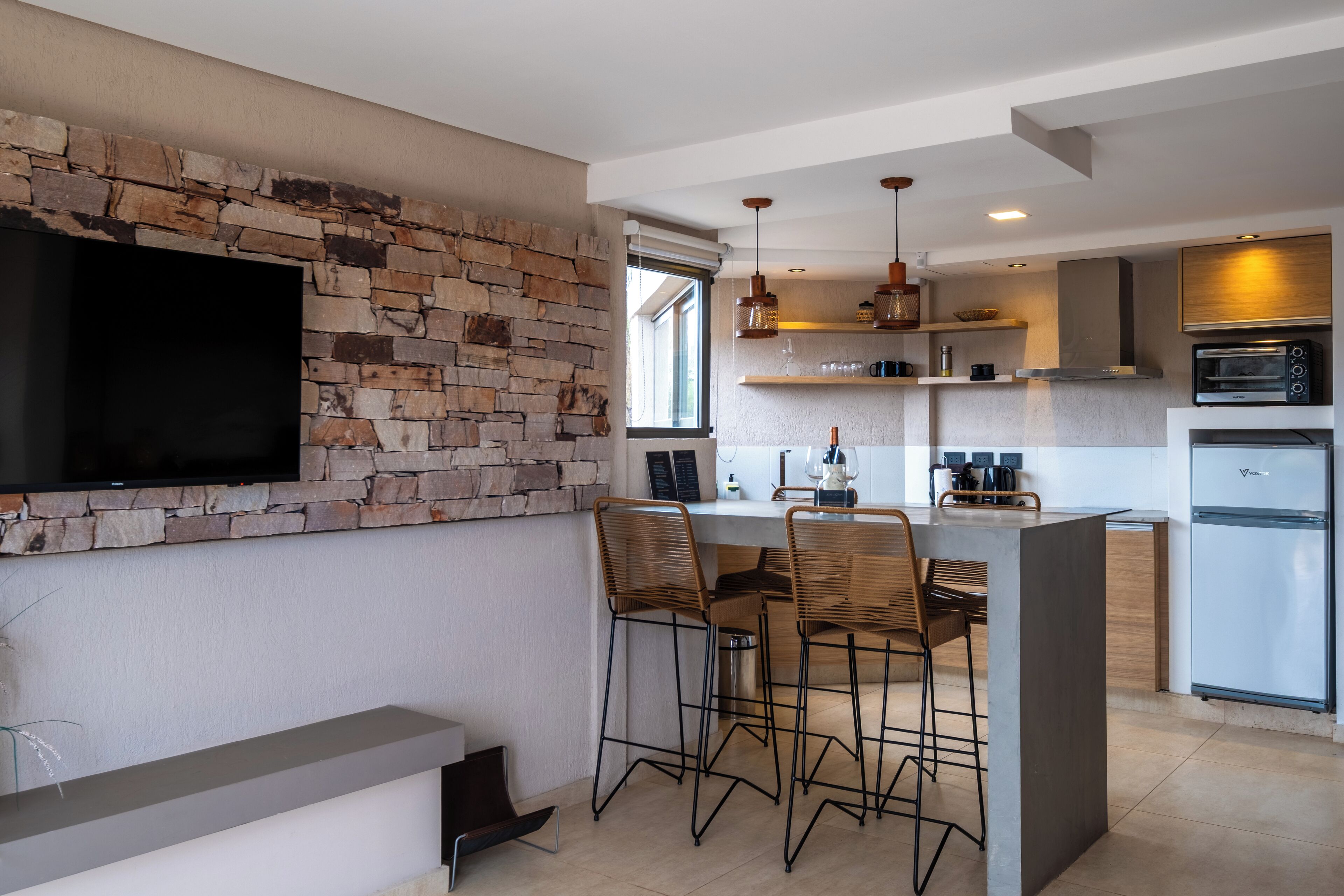 Exclusive Suite | Living area | 42-inch Smart TV with digital channels, heated floors