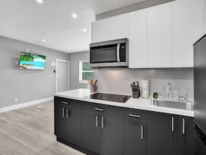 Fridge, microwave, stovetop, coffee/tea maker