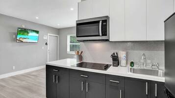 Fridge, microwave, stovetop, coffee/tea maker