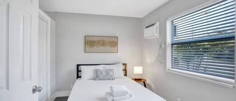 1 bedroom, desk, iron/ironing board, travel crib