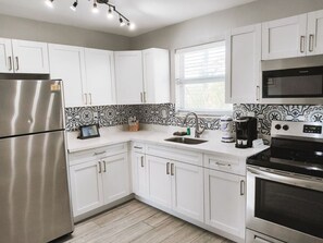 Fridge, microwave, stovetop, coffee/tea maker