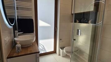 Shower, hair dryer, towels, soap