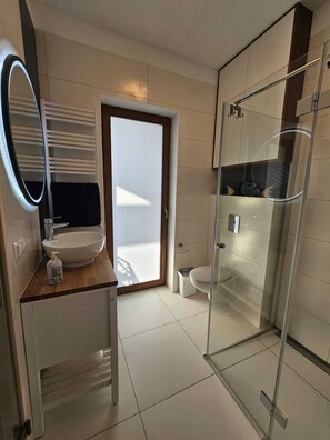 Shower, hair dryer, towels, soap