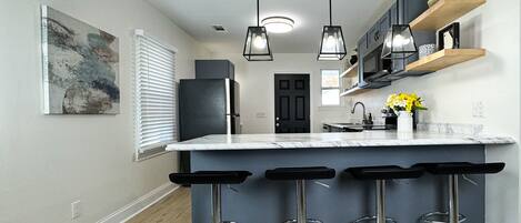 Coffee/tea maker, fridge, microwave, oven