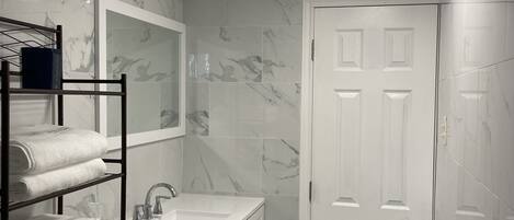 Shower, hair dryer, towels, soap