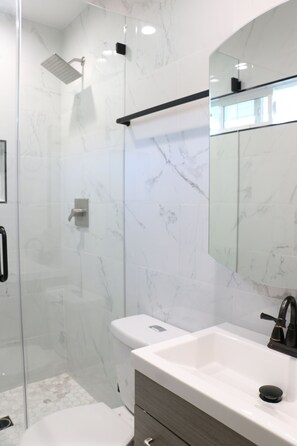 Shower, hair dryer, towels, soap