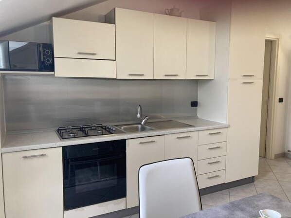 Fridge, microwave, toaster, cookware/dishes/utensils