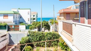 A residential area with buildings overlooking a body of water. - Cosy apartment for 4 guests with WIFI, TV and terrace (Torvaianica)