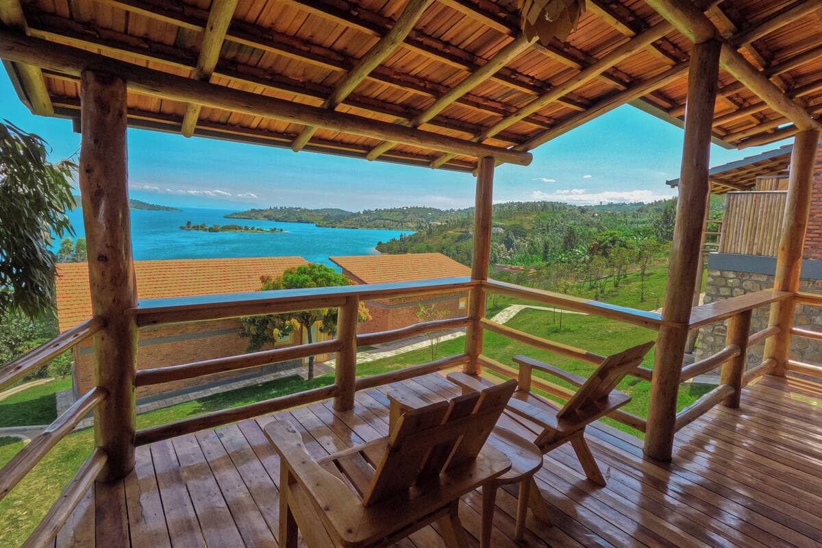 A wooden deck with a view of a coastal landscape.