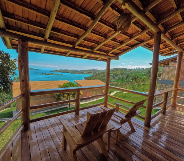 A wooden deck with a view of a coastal landscape.