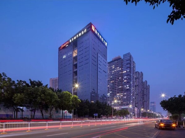 Standing tall in the city, this high-rise hotel offers stunning views from its glass facade.