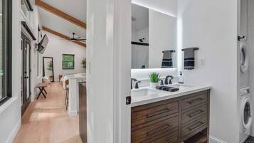 Shower, hair dryer, towels, shampoo