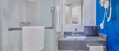 Shower, rainfall showerhead, hair dryer, towels